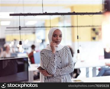 african americam modern muslim businesswoman portrait wearing hijab at creative modern startup coworking open space office. African muslim businesswoman portrait at office