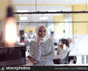 african americam modern muslim businesswoman portrait  wearing hijab at creative modern startup coworking open space office