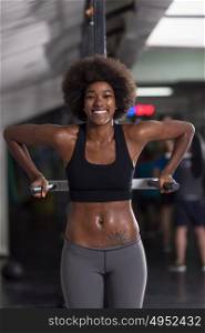 african american athlete woman workout out arms on dips horizontal parallel bars Exercise training triceps and biceps doing push ups