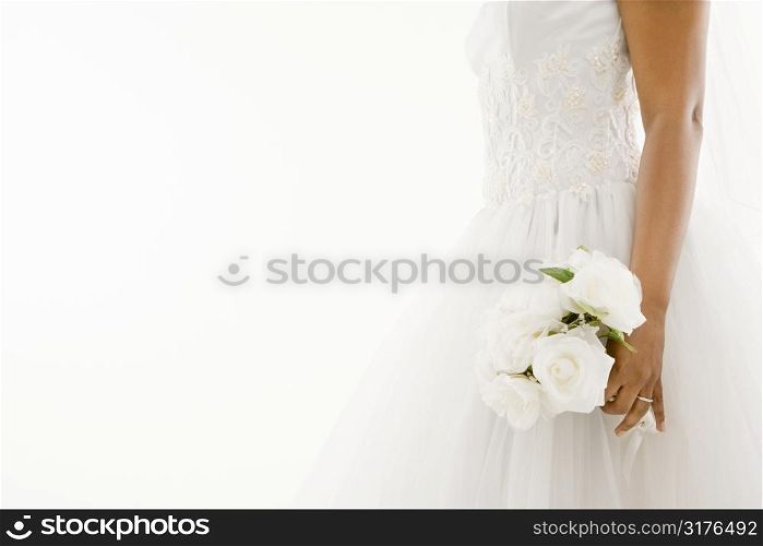 African-American bride holding bouquet.