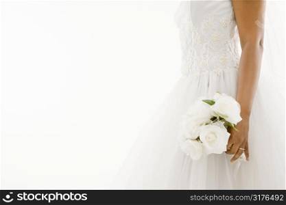 African-American bride holding bouquet.