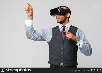 African-american Business man using a virtual reality VR headset.. African-american Business man using a virtual reality VR headset