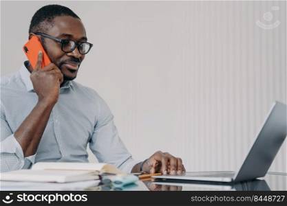 African american businessman has phone call in front of camera of computer. Happy guy in formal wear has video meeting in zoom. Remote conference or consultation at home. Online freelance job.. African american businessman has phone call in front of camera of computer. Online freelance job.