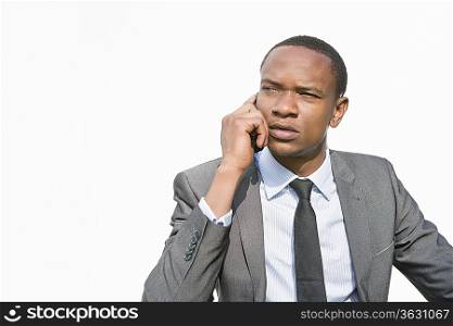 African American businessman on a call over white background