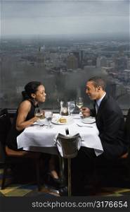 African-American couple having dinner at the Tower of the Americas in San Antonio, Texas.