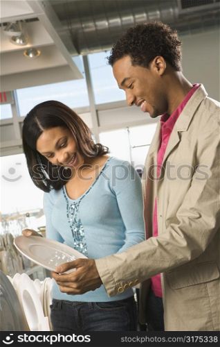 African American couple shopping in a home furnishings retail store.