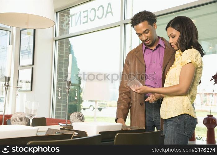 African American couple shopping in retail store.