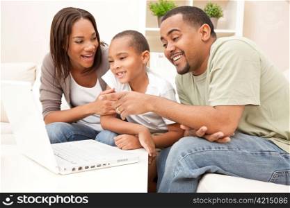 African American Family Using Laptop Computer