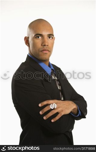 African American man in suit wearing ring with money sign.