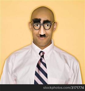 African American man wearing groucho mask disguise.
