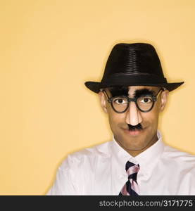 African American man wearing groucho mask disguise.