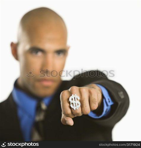 African American man wearing ring with money sign.