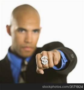 African American man wearing ring with money sign.