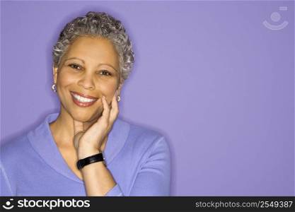 African American mature adult female smiling looking at viewer.