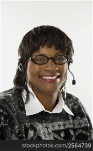 African-American mid-adult woman wearing headset.