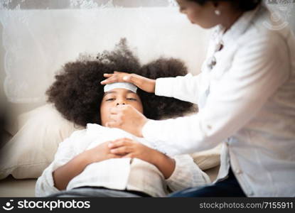 African American people, Mother is taking care of a sick daughter