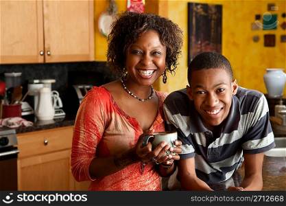 African-American woman and young man in kitchen