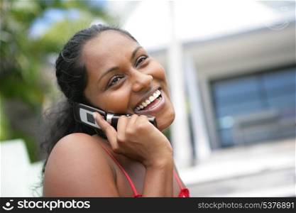 African American woman laughing during call