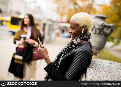African american woman listening music outdoor
