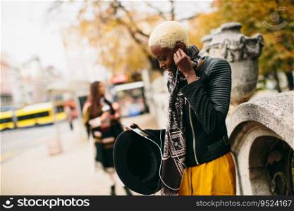 African american woman listening music outdoor