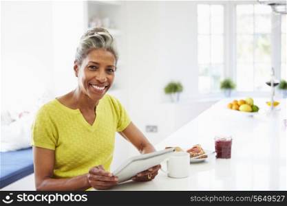 African American Woman Using Digital Tablet At Home