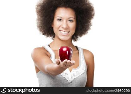 African American young woman holding and showing a red apple