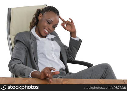 African business woman sitting at her desk and thinking isolated on white background