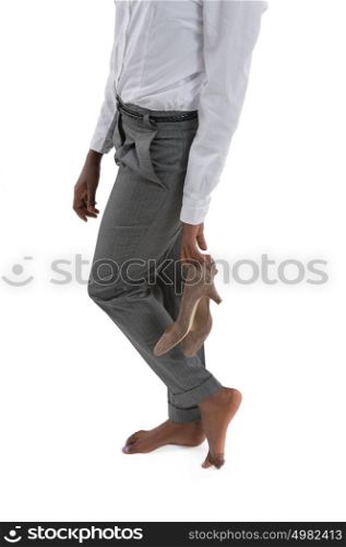 African business woman taking off shoes isolated on white background