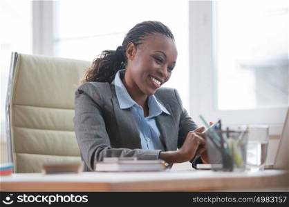 African Business woman working using laptop computer in office