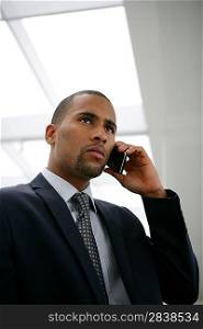 African businessman calling his boss
