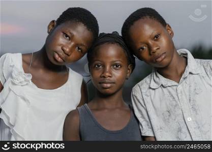 african children standing head head