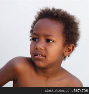 African little kid four years in a happy summer day. African little kid four years without a shirt on a summer day