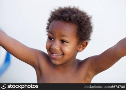 African little kid four years in a happy summer day. African little kid four years without a shirt on a summer day
