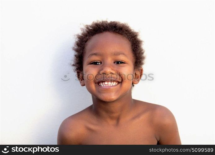 African little kid four years without a shirt on a summer day