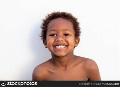 African little kid four years without a shirt on a summer day
