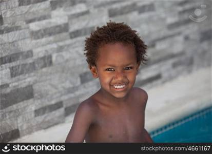 African little kid three years in the pool on summer