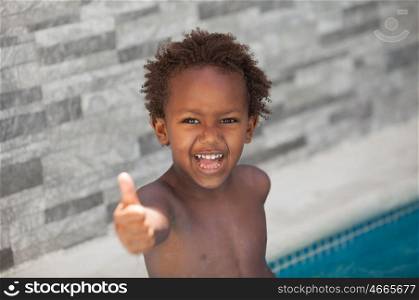 African little kid three years in the pool on summer