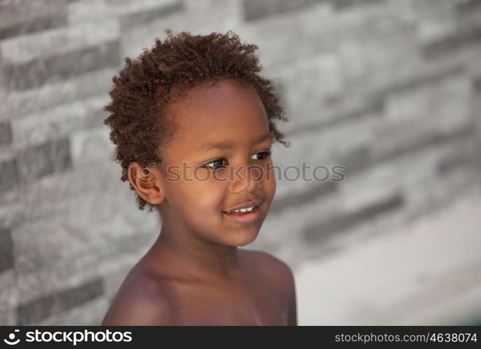 African little kid three years without a shirt on a summer day