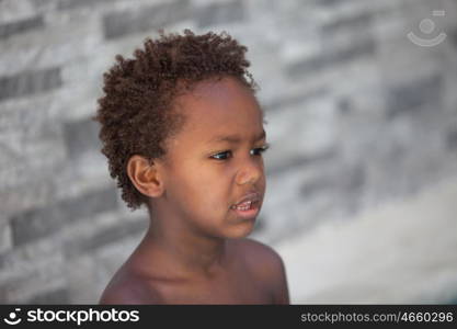 African little kid three years without a shirt on a summer day