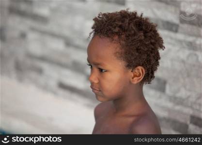 African little kid three years without a shirt on a summer day