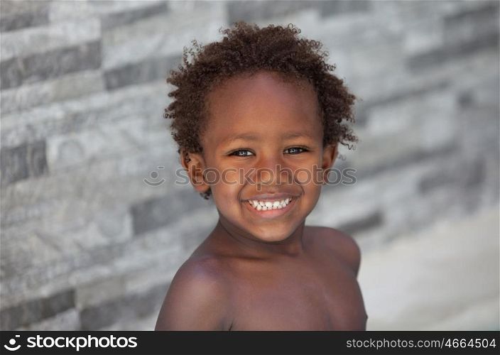 African little kid three years without a shirt on a summer day