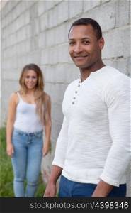 African man and caucasian girl. Young happy couple at outside