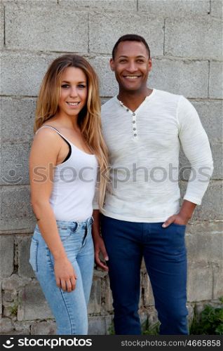 African man and caucasian girl. Young happy couple at outside