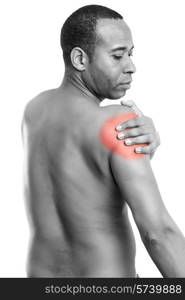 African man holding his shoulder in pain, isolated over white