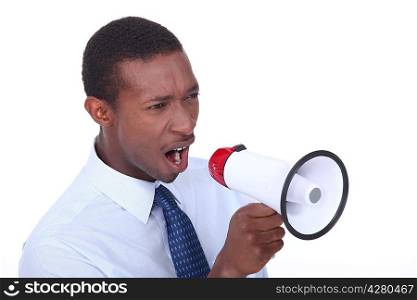 African man shouting through a megaphone