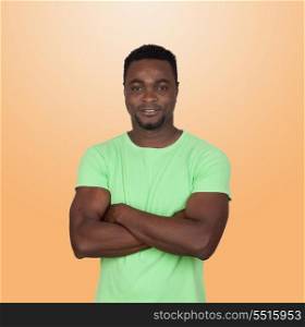African muscled man isolated on a over a orange background
