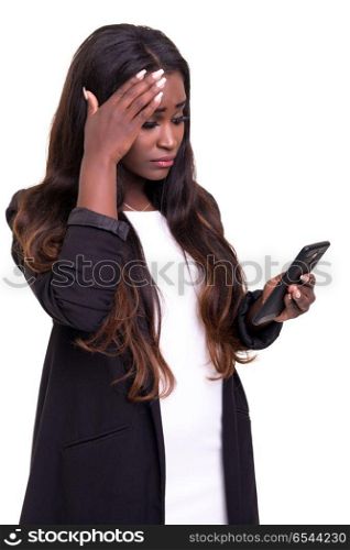 African woman at the phone. Young beautiful african woman at the phone, isolated over white background