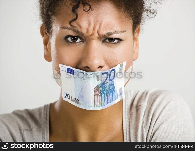 African woman covering her mouth with a euro banknote, great concept for the global crises