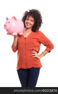 African woman putting some money into a piggy bank