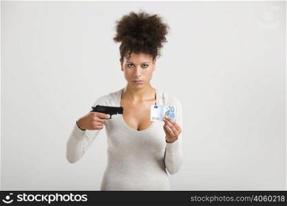 African woman shooting a euro banknote, great concept for the global crises